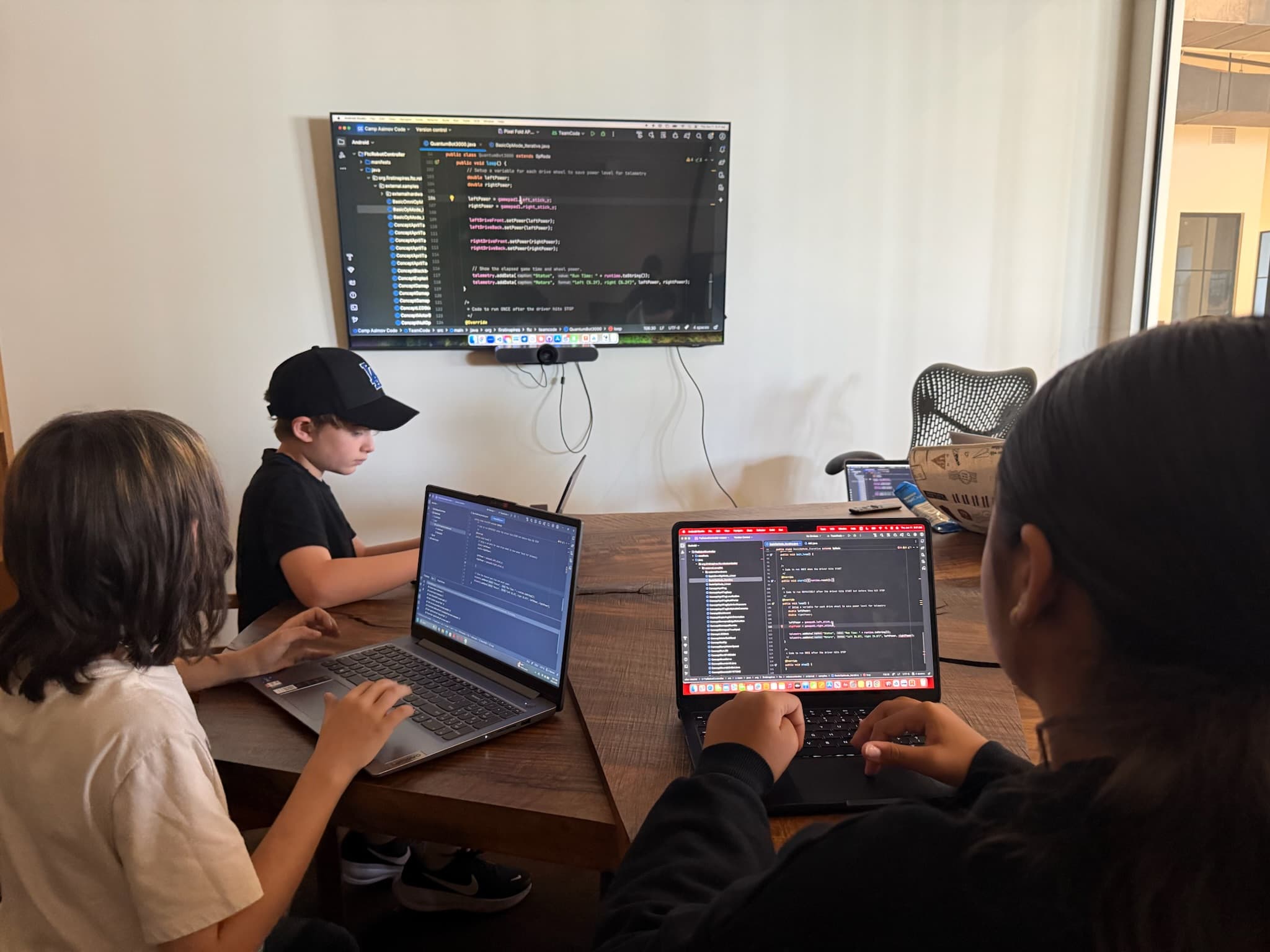 Student programming a robot at Camp Asimov