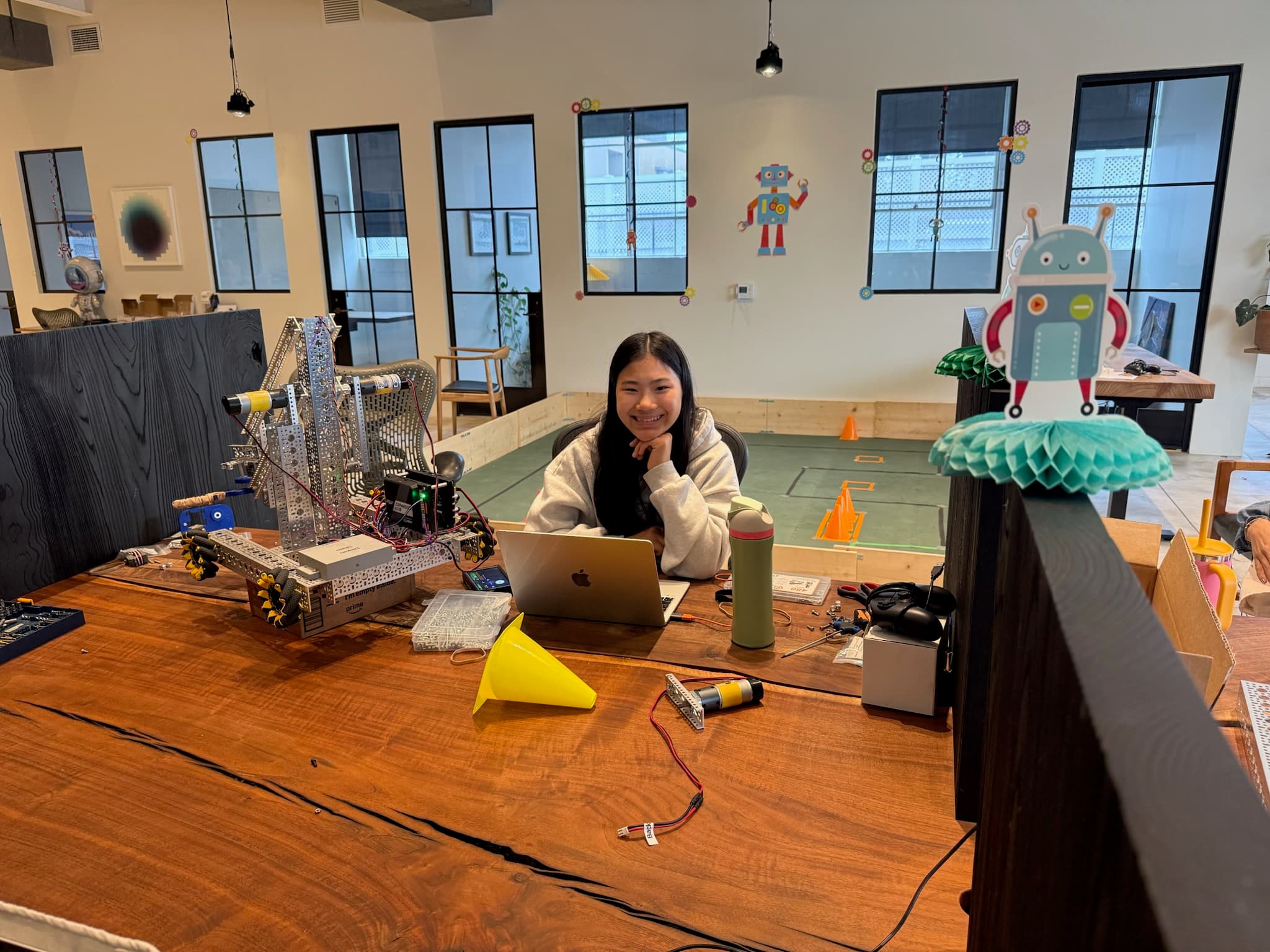 Camp Asimov student working with a robot